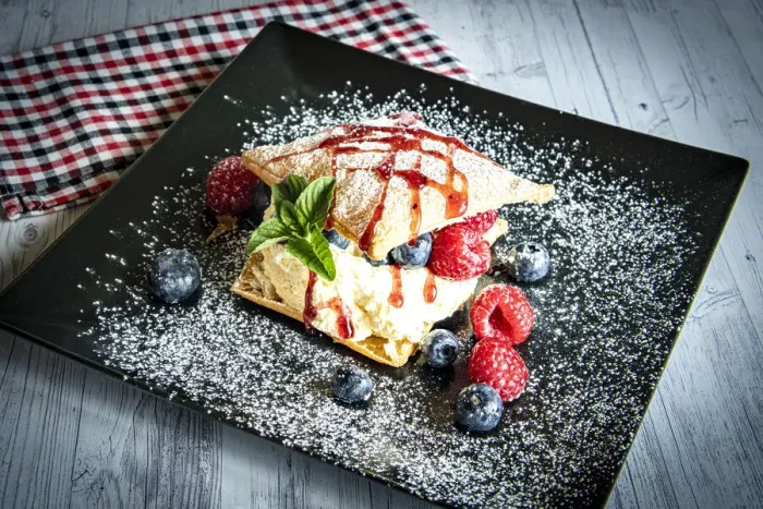 Framed Print : Puff cake dessert with berries garnished with caramel, Italy Framed Print : Puff cake dessert with berries garnished with caramel, Italy