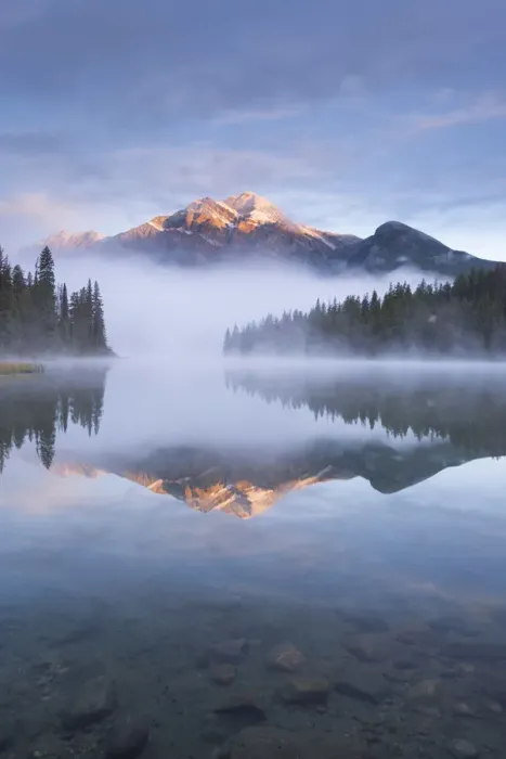 Framed Print : Pyramid Mountain in the Canadian Rockies surrounded by mist and reflected in Pyramid Lake