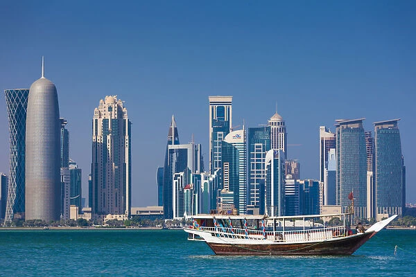 Qatar, Doha, Dhows on Doha Bay with West Bay skyscrapers
