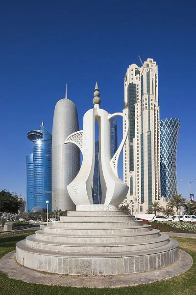 Qatar, Doha, Doha Bay, West Bay Skyscrapers, morning, with large coffeepot sculpture