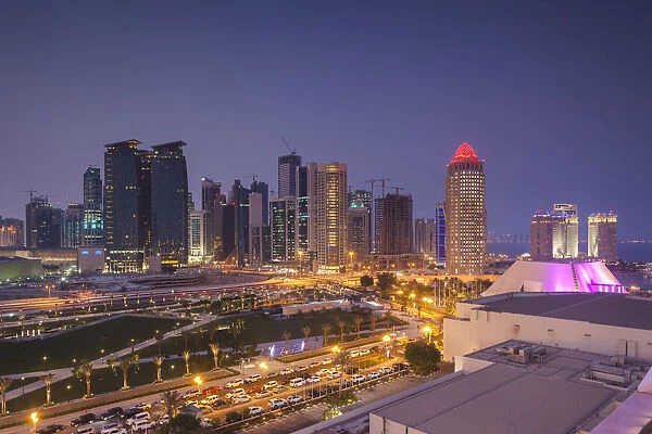 Qatar, Doha, Doha Bay, West Bay Skyscrapers, elevated view, dusk
