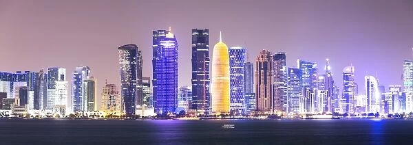 Qatar, Doha. Skyline with skyscrapers, at night from the Corniche