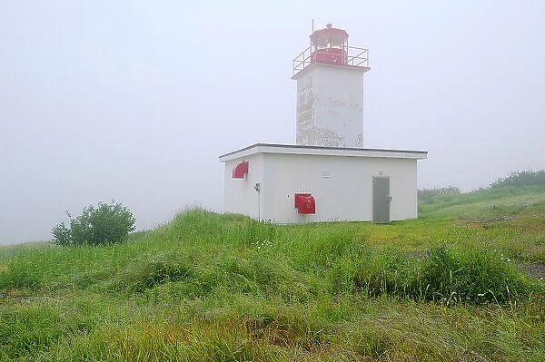 Quaco Head Lighthouse in fog on Bay of Fundy Saint Martins, New Brunswick, Canada
