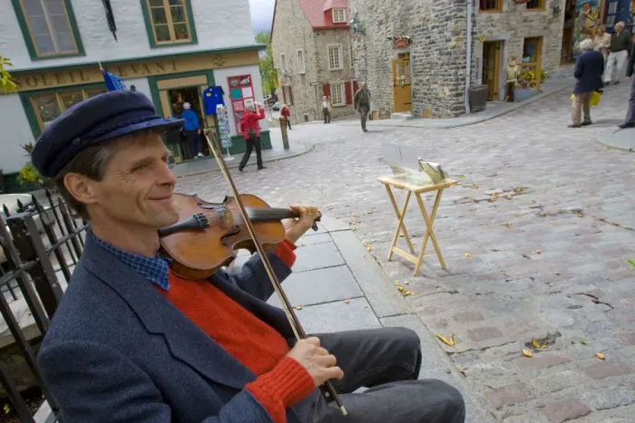 Framed Print : Quebec City, Canada. A street busker palying fiddle for tourist crowds in Old Quebec City Framed Print : Quebec City, Canada. A street busker palying fiddle for tourist crowds in Old Quebec City