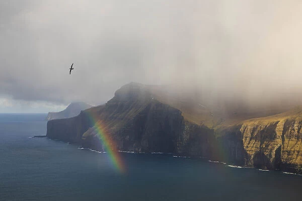 Rainbow along the coast of Eysturoy. Faroe Islands
