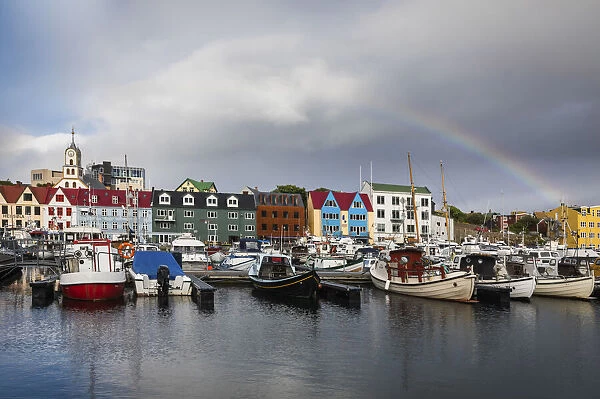A rainbow above the harbour of Torshavn, the capital of the Faroe Islands. Streymoy, Faroe Islands