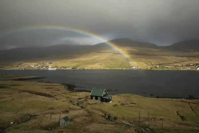 Framed Print : A rainbow above a solitary house in Nesvik. Streymoy, Faroe Islands Framed Print : A rainbow above a solitary house in Nesvik. Streymoy, Faroe Islands