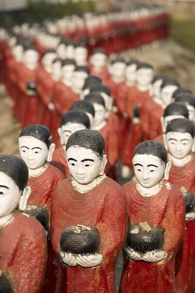 Rakhine state, Myanmar. Monks statues lined up in a pagoda