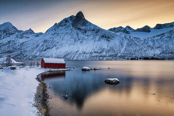 Red Boat Hut & Mountain Peak Reflecting in Bergsbotn Fjord, Senja, Norway