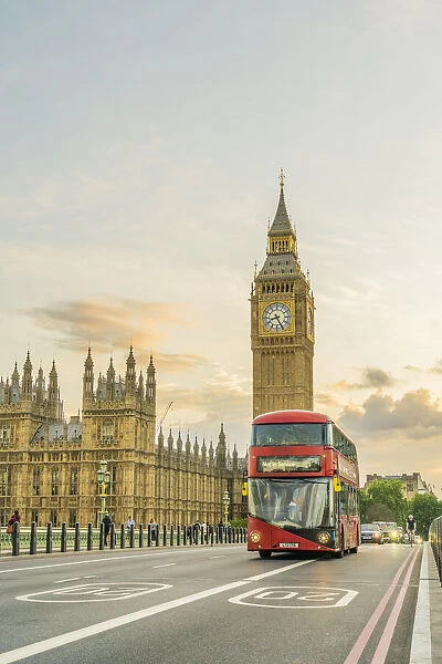 A red bus on Westminster Bridege and Big Ben, also known as Elizabeth Tower. Part of the Houses of Parliament and a Unesco World Heritage site, London, England, UK