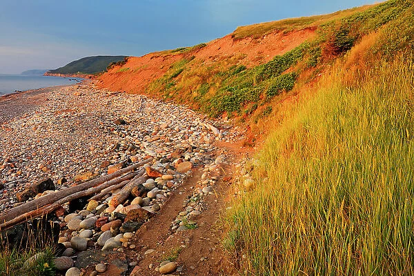 Red cliffs at sunset on Cabot Trail Pleasant Bay Nova Scotia, Canada
