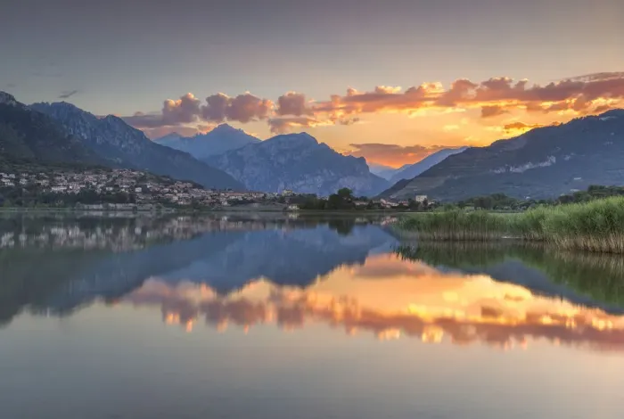Framed Print : Red clouds and Lecco mountains reflected on lake Annone, Lecco province, Brianza
