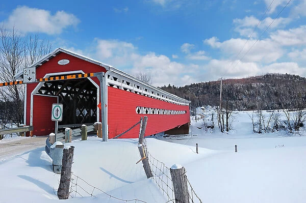 Red covered bridge across the Du Diable River Prud'Homme Quebec, Canada