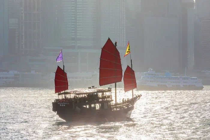 Framed Print : A Red Sail Junk in Hong Kong Harbour, Hong Kong, China