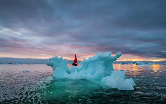 Framed Print : Red sailboat and blue iceberg at sunset in Disko Bay, Greenland Framed Print : Red sailboat and blue iceberg at sunset in Disko Bay, Greenland