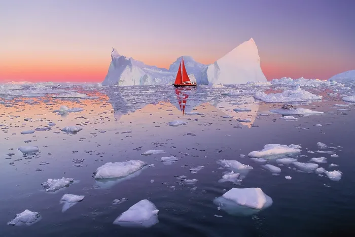 Framed Print : Red sailboat at dusk near icebergs in Disko Bay, Greenland Framed Print : Red sailboat at dusk near icebergs in Disko Bay, Greenland