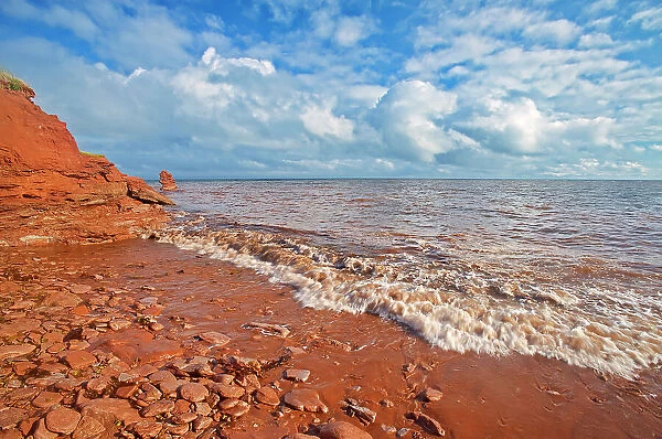 Red sandstone cliffs along the Gulf of St. Lawrence. SIte of the remnant of Elephant Rock'. North Cape, Prince Edward Island, Canada