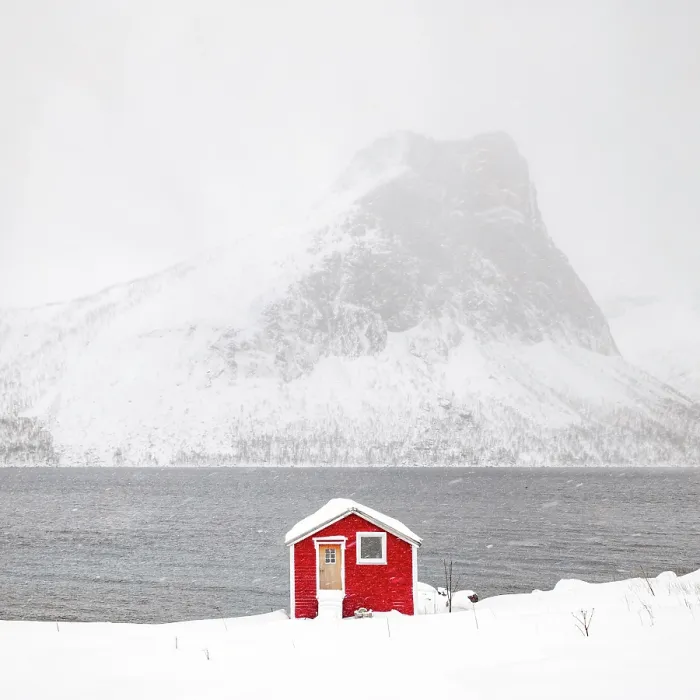 Framed Print : Red timber rorbu (cabin) with Bergsfjord and snow-covered mountains in the distance, , Bergsbotn, Senja, Norway Framed Print : Red timber rorbu (cabin) with Bergsfjord and snow-covered mountains in the distance, , Bergsbotn, Senja, Norway