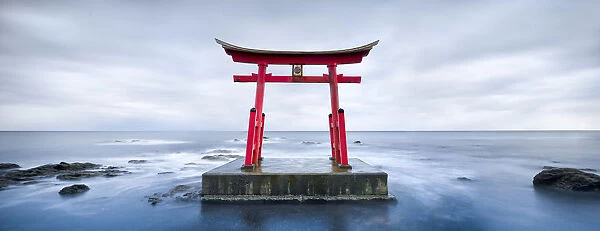 Red torii gate near Shosambetsu, Hokkaido, Japan