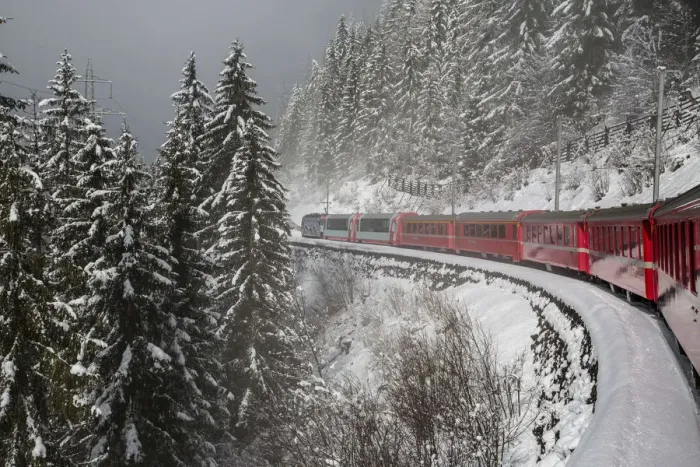 Framed Print : Red train travelling through the snowy woods of Filisur on the highest railway across Framed Print : Red train travelling through the snowy woods of Filisur on the highest railway across