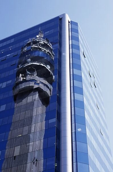 Reflection of the Entel Communications Tower in an office building
