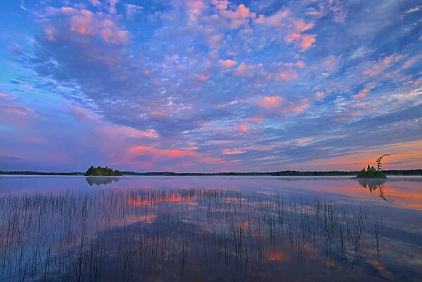Reflection on Lac des Sables at sunrise Belleterre, Quebec, Canada