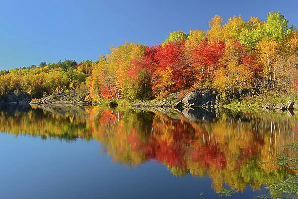 Reflection in Simon Lake. Simon Lake Park Conservation Area. Naughton, Ontario, Canada