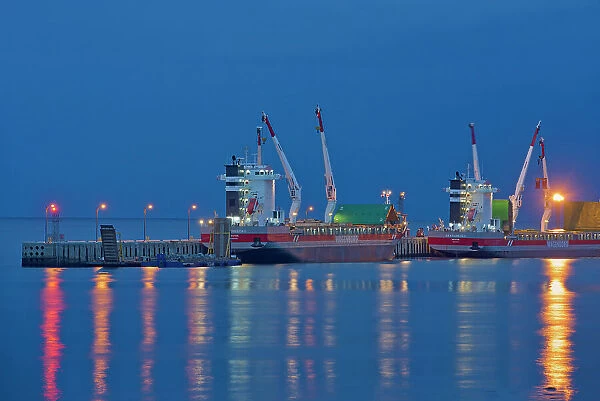 Reflections of cargo ships at dock in the North Shore of the Gulf of St. Lawrence Baie Comeau, Quebec, Canada