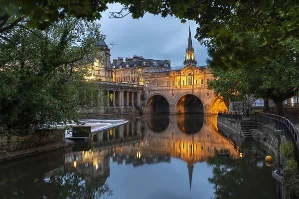 Reflections of Pulteney Bridge in the River Avon at twilight, Bath, Somerset, England