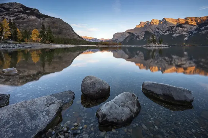 Framed Print : Reflections on the shore of Lake Minnewanka in the Canadian Rockies, Banff National Park, Alberta, Canada. Autumn (October) 2024 Framed Print : Reflections on the shore of Lake Minnewanka in the Canadian Rockies, Banff National Park, Alberta, Canada. Autumn (October) 2024