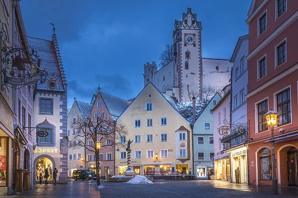 Reichenstrasse in the old town of Fuessen with a view of Hohes Schloss, Allgaeu, Bavaria, Germany