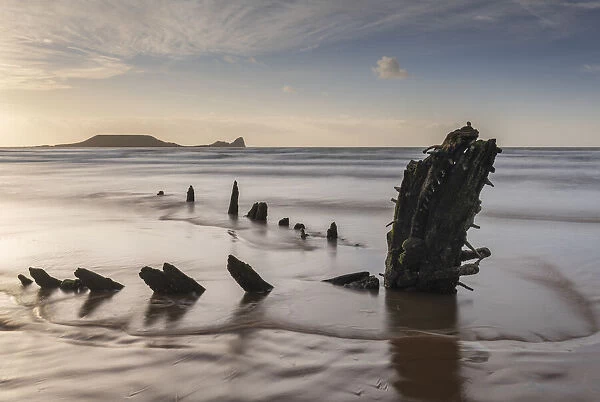 Remains of the shipwreck Helvetia on Rhossili Beach, with Worm