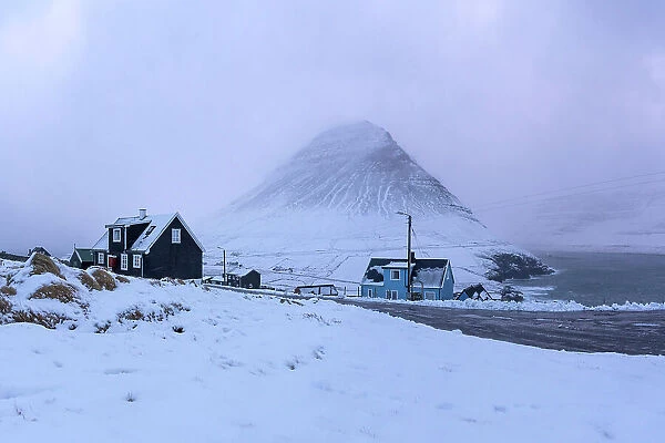 The remote village of Viðareiði covered by snow. Island of Viðoy. Faroe Islands