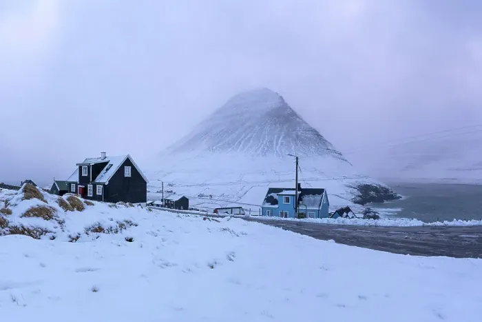 Framed Print : The remote village of Viðareiði covered by snow. Island of Viðoy. Faroe Islands