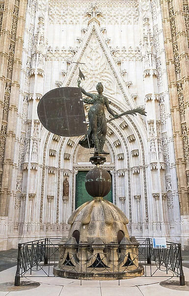 Replica of the Giraldillo statue that symbolizes Christian Faith, Hope and Victory at the entrance to Catedral de Santa Maria de la Sede (Cathedral of Seville), Seville, Andalusia, Spain