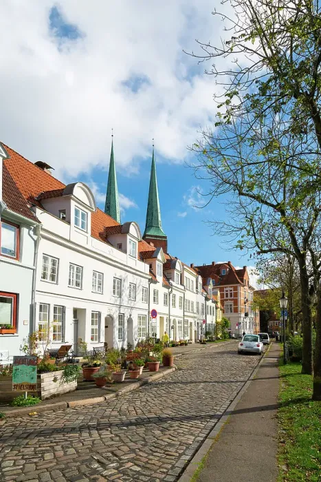 Framed Print : Residential buildings by Trave river with towers of Lubeck Cathedral in background, Lubeck, UNESCO, Schleswig-Holstein, Germany Framed Print : Residential buildings by Trave river with towers of Lubeck Cathedral in background, Lubeck, UNESCO, Schleswig-Holstein, Germany