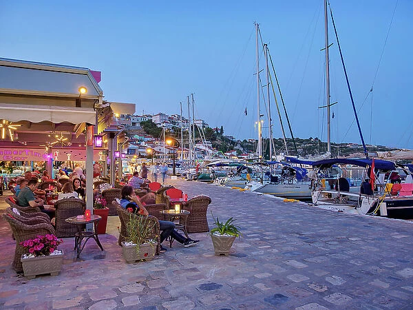 Restaurants at the waterfront at dusk, Port of Pythagoreio, Samos Island, North Aegean, Greece