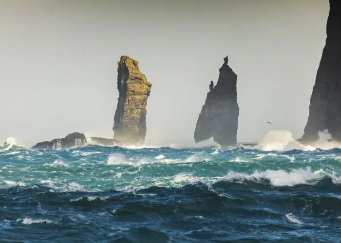 Framed Print : Risin og Kellingin sea stacks hit by rough ocean. Eysturoy, Faroe Islands