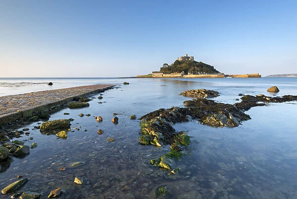 Rising tide floods Mounts Bay and the stone causeway at St Michaels Mount, Marazion