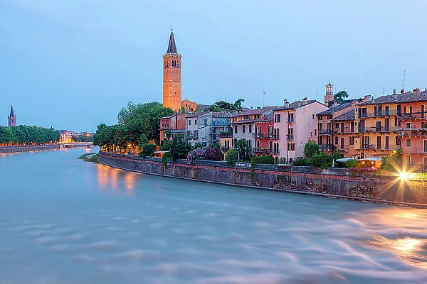 River Adige and Basilica of Saint Anastasia at dusk from Ponte Pietra. Verona, Veneto, Italy