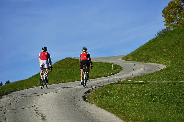 Road cyclists on electric bikes before Hohe Salve, Kelchsau, Kitzbuehler Alps, Tirol