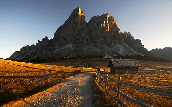Road to the Sass de Putia during a fall sunset, Dolomites, Italy