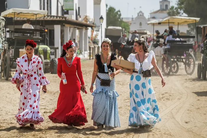 Framed Print : Roceras women pilgrims traditionally dressed walking in a street during the Romeria de El Rocio pilgrimage, El Rocio, Huelva, Andalusia, Spain Framed Print : Roceras women pilgrims traditionally dressed walking in a street during the Romeria de El Rocio pilgrimage, El Rocio, Huelva, Andalusia, Spain