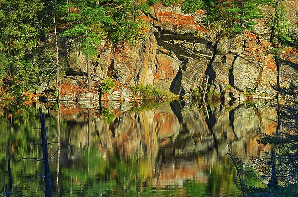 Rock pattern reflection in lake Dorset, Ontario, Canada