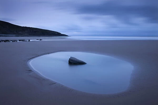 Rockpool on the sandy Southerndown beach at dawn, Dunraven Bay, Glamorgan Heritage Coast