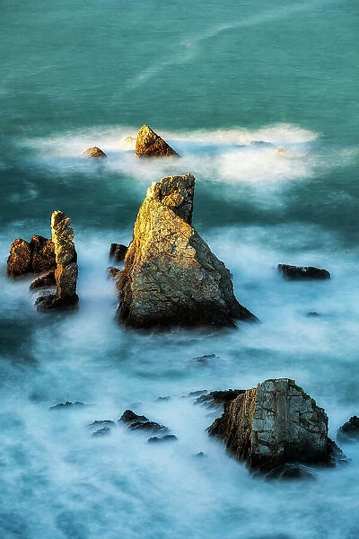 Rocky islets at Playa Gueirua, Cudillero, Asturias, Spain