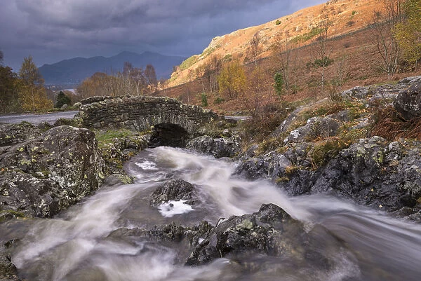 Rocky stream tumbling under Ashness Bridge in the Lake District National Park, Cumbria