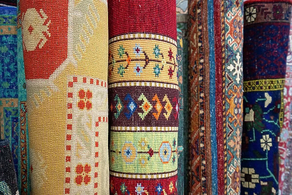 Detail of rolled carpets on display at store, Avanos, Avanos District, Nevsehir Province, Cappadocia, Central Anatolia Region, Turkey