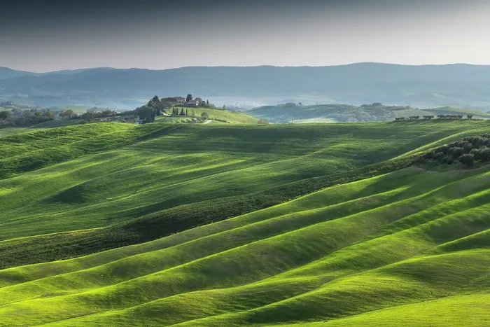 Framed Print : The rolling hills illuminated by the later afternoon light in the Crete Senesi, Tuscany, Italy Framed Print : The rolling hills illuminated by the later afternoon light in the Crete Senesi, Tuscany, Italy