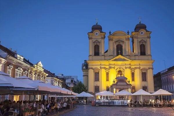 Roman Catholic Cathedral and outdoor cafes in Piata Unirii, Timisoara, Banat, Romania